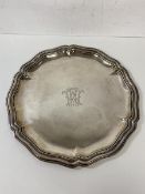 A continental salver with scalloped edge and monogram to centre inscribed 835 to base and C Buch,