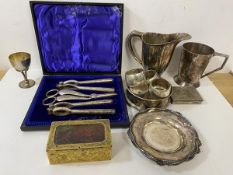 A mixed lot of Epns including a boxed set of scissors and nutcrackers, napkin rings, jug, mug also a