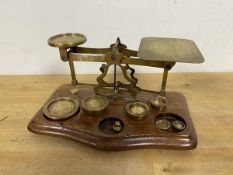 A set of vintage scales inscribed Rates of Postage Not Exceeding 1 Ounce 1d down to 16 - 5, along