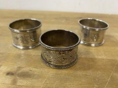 A pair of Sheffield silver napkin rings and a Victorian Scottish silver napkin ring, makers mark WM,