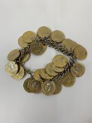 A double curb link chain with collection of gilded farthings including 1860 to 1955, measures 9cm