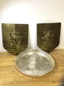 A pair of modern wall shields with brick and lion decorations, measure 33cm x 27cm and a drinks tray