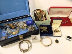 A quantity of costume jewellery including necklaces, brooches, pins, a tiger eye, pendant