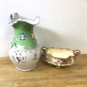 A late 19th early 20thc Moore Bros water pitcher with floral decoration, measures 32cm high, and a