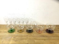 A set of five sorbet bowls, each with etched floral decoration on coloured glass stems and bases