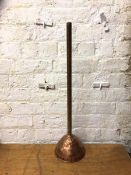 A vintage copper and wood handled washing dolly marked Weekly, 80cm high