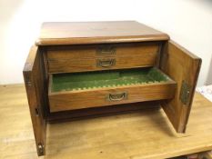 Early 20thc oak Walker & Hall canteen topped with brass shield with initial over two doors before