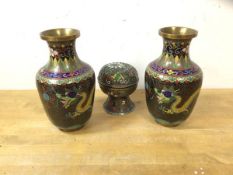 A pair of Chinese cloissonne vases depicting dragons chasing pearls of wisdom, each measures 17cm