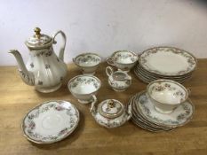 A part German teaset including teapot which measures 22cm high, four teacups, six saucers, six