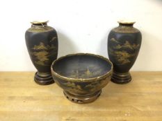 A pair of 1920's Satsuma faceted baluster shaped vases each with wooden stand, measure (together)