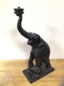 A carved wooden table lamp in the form of an elephant, measures 54cm high