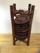 A Chinese plate carrier, the hinged wooden frame containing ten wooden plates, measures 47cm high