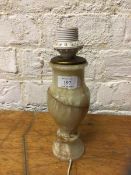 A polished stone baluster shaped table lamp, 28cm high