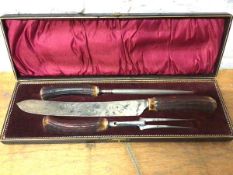 A bone handled carving set in original box which measures 40cm x 13cm