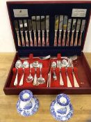 A pair of Spode Italian pattern candlesticks (8cm h), a Viners silver plated canteen (3)