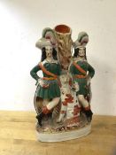 A 19thc Staffordshire flatback figure of two gentlemen with spaniel spill vase, (30cm h)