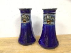 A pair of early 20thc Royal Doulton vases with collars depicting a bucket of roses, (21cm h)