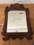 A 19thc wall mirror with walnut and mahogany frame and shell inlay to surmount, (45cm x 32cm)