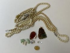 A two tone stone pendant depicting dragon and pearl on yellow metal mount, (6cm), loose pearls,
