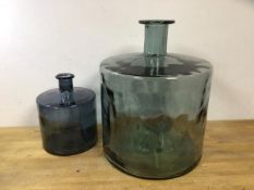 A large glass bottle (44cm x 35cm) and a smaller bottle (2)