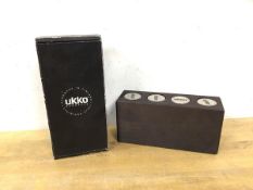 An Ukko Finland Schnapps stainless steel shot glasses in wooden stand, (8cm x 17cm x 5cm)