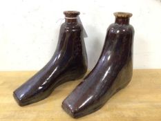A pair of late 19th early 20thc novelty glazed stoneware bottles in the form of a left and right