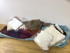 A collection of textiles including two woollen blankets, christening gown, embroidered place mats, a