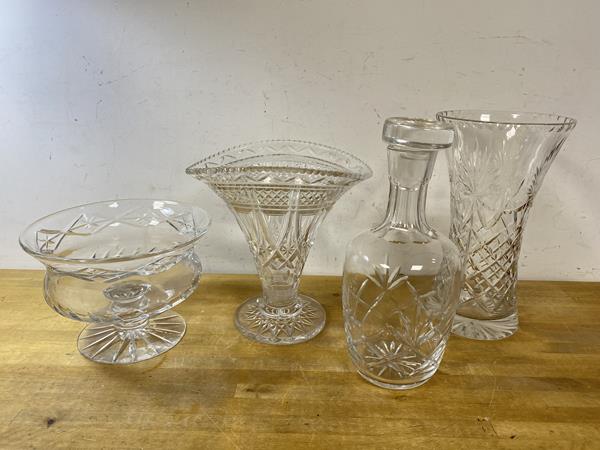 A glass decanter with associated stopper, (26cm h), two glass vases and footed bowl (4)