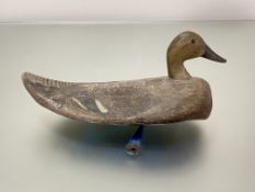 Folk Art: an early 20th century painted wooden decoy duck, with painted initials and lead weight
