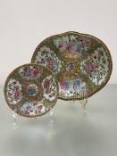 A 19th century Canton famille rose platter, of shaped oval form, painted with alternating figural