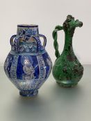 An Indo-Persian fritware baluster jar, with five loop handles, painted with figural panels; together