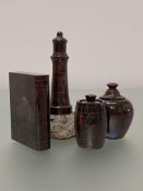 A group of late 19th/early 20th century red Cornish serpentine desk ornaments comprising: a book-
