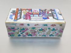 A Chinese famille rose porcelain pen box and cover, c. 1900, of rectangular form, the lift-off cover