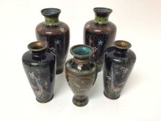 Five Japanese cloisonné vases, circa 1900, including two pairs and another, the largest measuring 15