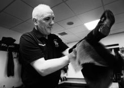 Jayne Odell black and white photographic print, 'The valet - polishing boots', 100cm x 71cm