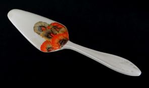RHODANTHE PATTERN CAKE SLICE, in honey glaze with moulded handle, 19cms long (glaze chip, unmarked)