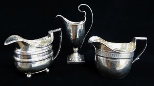 THREE GEORGE III SILVER MILK JUGS, London 1782, 1807, 1809, of helmet and oval forms, tot appr wt