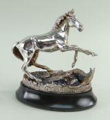 CAST SILVER MODEL OF A HORSE, 'Startled Yearling' by Geoffrey Snell on oval base, produced for The