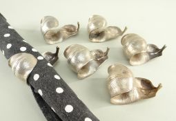 SET OF SIX SILVER NAPKIN / SERVIETTE HOLDERS, Garrard & Co Ltd., London 1968 / 69, of naturalistic