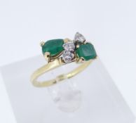 YELLOW GOLD EMERALD & DIAMOND RING, twist shank, stamped '750', ring size P, 4.1gms Provenance: