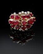 YELLOW GOLD RUBY & DIAMOND CLUSTER RING, of tiered design, ring size J / K, 6.4gms Provenance: