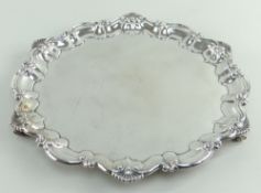 LATE VICTORIAN SILVER SALVER, shell and scroll border, raised on three scroll feet, Birmingham 1897,