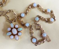 OPAL SET JEWELLERY comprising yellow metal opal nine stone flower head pendant on 14ct gold chain,