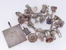 SILVER BRACELET WITH HEART SHAPED PADLOCK having various white metal charms, together with four