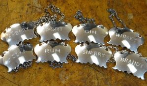 SET OF EIGHT SILVER DECANTER LABELS, A Haviland-Nye, London 1970, comprising 2 x 'Sherry', 'Whisky',