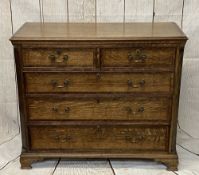 ANTIQUE OAK & CROSSBANDED MAHOGANY CHEST of two short over three long oak lined drawers, having oval