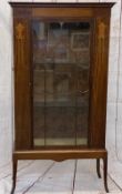CIRCA 1900 INLAID MAHOGANY DISPLAY CABINET having ribbon swag inlays flanking a central glazed door,