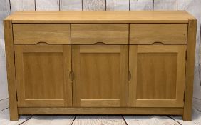 ULTRA-MODERN LIGHT OAK SIDEBOARD on substantial corner block supports, having three frieze drawers
