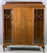 CIRCA 1920 MAHOGANY RAILBACK CHINA CABINET with two glazed doors either side of a central door, on