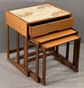 G-PLAN MID CENTURY TEAK NEST OF THREE COFFEE TABLES, the larger with tiled top and single drawer,
